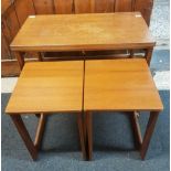 A McINTOSH MID CENTURY HINGED TOP COFFEE TABLE ON CASTERS WITH A PAIR OF SMALLER COFFEE TABLES