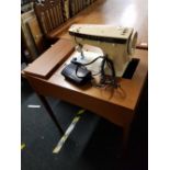 SINGER ELECTRIC SEWING MACHINE IN TEAK TABLE