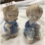 PAIR OF COPENHAGEN STYLE CERAMIC FIGURES OF CHILDREN