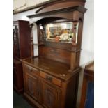 ARTS & CRAFTS CARVED MAHOGANY DRESSER WITH MIRRORED BACK, TURNED PILLARS, 2 CUPBOARDS & PAIR OF