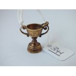 A miniature cup charm in 9ct - 4.2gms