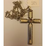 A large silver cross on a chain