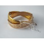 Two rolled gold bangles