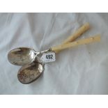 A pair of Victorian ascetic period serving spoons with engraved bowls, branch effect handles -