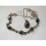 A silver & marcasite pendant & bracelet