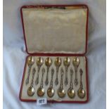 An attractive boxed set of twelve parcil gilt coffee spoons with apostle finials - London 1907 - 146