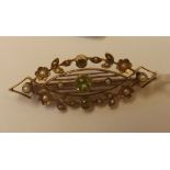 A pearl & peridot brooch in 15ct gold