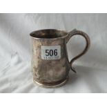 A GEORGE II MUG WITH A TUCK-IN BASE AND SCROLL HANDLE - 3.5" HIGH - LONDON 1738 - MARED ON BASE