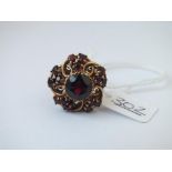 A large garnet cluster ring in 9ct - size W - 6.8gms