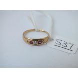 A ruby & diamond gypsy set ring in 18ct gold - size M - 1.8gms