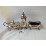 Three piece cruet set on paw feet - Birmingham 1968 Goldsmiths Co - 188 gms. Excluding liners