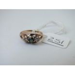 A 9ct 3-stone ring with central tourmaline between 2 diamonds - size J - 2.27gms