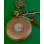 A gilt half hunter pocket watch together with a Dogma padlock watch