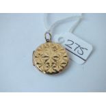 A circular back & front locket in 9ct - 3.7gms