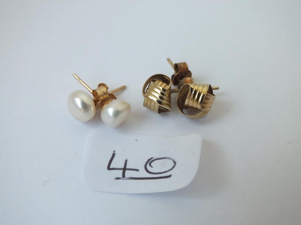 Two pairs of earrings (one pearl, one knot) in 9ct