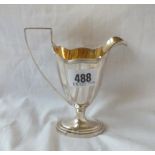 A Georgian style sterling silver helmet shaped cream jug with gilt interior - 5.5" high - 108 gms.