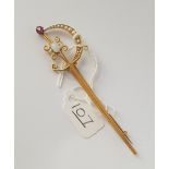 An unusual crescent brooch with ruby, pearls & moonstone (1 stone slightly chipped) in 15ct gold -