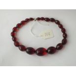 A string of red coloured beads