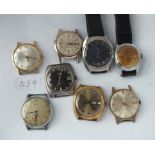 A bag of eight vintage wristwatches, mainly gents