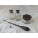 A tortoiseshell and silver-mounted jar, two mounted bottles and a button hook