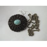 A continental silver pendant/brooch set with a stone - 59gms