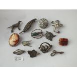 Twelve silver brooches