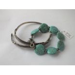 A turquoise & silver bracelet with 2 others