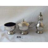 An Art Deco style three piece set on spreading bases - Birmingham 1920 by EWH - 103 gms excluding
