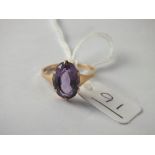 A solitaire amethyst ring in 9ct - size M - 2.1gms