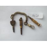 A watch key on a chain and two others