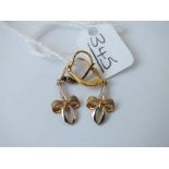 A pair of tied ribbon 2 colour earrings in 9ct - 1.8gms