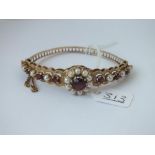 AN ATTRACTIVE PEARL & GARNET BANGLE - 16gms