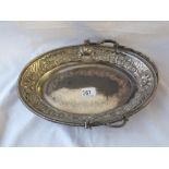 A Victorian oval cake basket with swing handle, beaded decoration - 12" long - Sheffield 1890 -