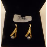 A boxed pair of 9ct pearl dangle earrings