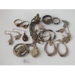 A quantity of assorted silver jewellery items - locket, rings etc. - 56gms