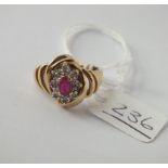 A ruby and diamond ring in 14ct gold - size M - 3.7gms