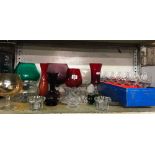 SHELF OF COLOURED GLASSWARE