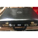 BLACK BRIEF CASE CONTAINING A WOOD BOXED PLAYING CARD DICE SET & LEAD MOULDING