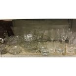 SHELF OF GLASSWARE INCL; CHAMPAGNE FLUTES, WHISKY GLASSES, GLASS CAKE STANDS & VASES