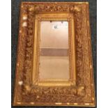 HEAVILY GILT FRAMED WALL MIRROR A/F