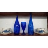 SHELF WITH BLUE GLASSWARE & 2 BLUE & WHITE CUPS & SAUCERS