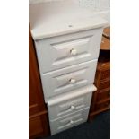 PAIR OF SMALL WHITE BEDSIDE CUPBOARDS WITH 2 DRAWERS IN EACH