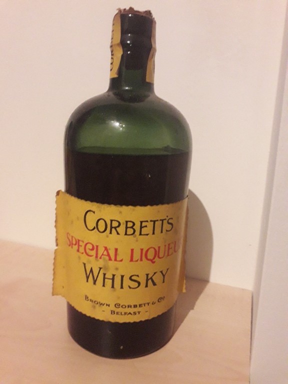 Corbett's 15 year old "Special Liqueur" whiskey. One bottle, also a bottle of Buchanan's "Reserve"