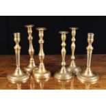 Three Pairs of 18th Century Candlesticks on round bases: two with flanged sockets and knopped stems