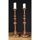 A Pair of Tall Turned Treen Candlesticks.