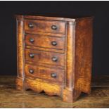 A 19th Century Figured Ash Miniature Chest of Drawers.