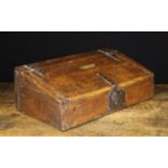 An 18th Century Oak Desk Box with sloped lid on iron strap hinges and an iron hasp & lock-plate to