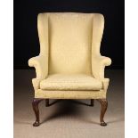 An Early Georgian Upholstered Armchair.