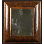An Early 18th Century Cushion Front Wall Mirror in an Oyster Veneered Frame with moulded borders,