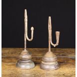 Two Similar Late 18th/Early 19th Century Style Wrought Iron Rushnips with turned treen bases.